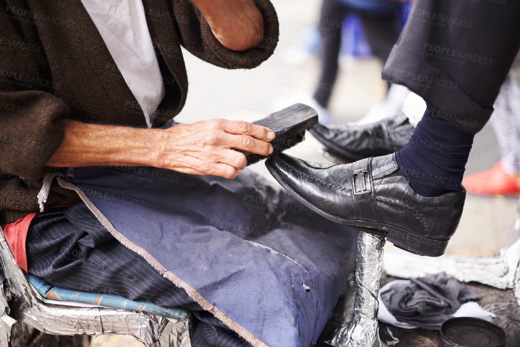 Buy stock photo Hands, shoes and shining brush for leather cleaning on city street for corporate customer or polish, apron or job. Person, service and business in downtown Sao Paulo or shine footwear, wax or outdoor