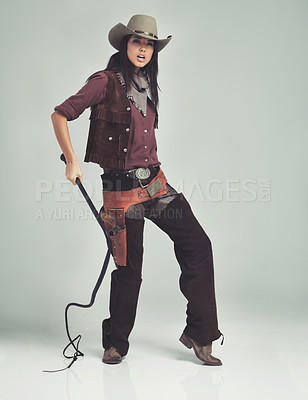 Buy stock photo Woman, cowgirl and portrait in studio for outfit costume with confidence on white background, weapon or outlaw. Female person, whip and hat with mockup space in Texas for dress up, old west or rodeo