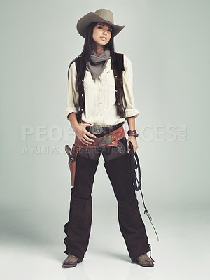 Buy stock photo Woman, cowgirl and outfit in studio, portrait and costume for western casting with rope or whip. Female person, cowboy hat and clothes from Texas, white background and dress up for audition or ad