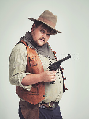 Buy stock photo Portrait, man and cowboy with a gun, confidence and person on a white studio background. Face, model and guy with a pistol and firearm with danger and warning with Halloween costume, proud and Texas
