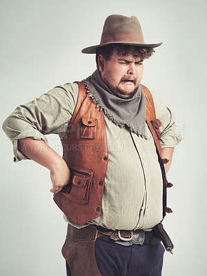 Buy stock photo Crying, cowboy and criminal with gun in studio mockup, outlaw and wild west character with pistol. Overweight texas man, bandit and vintage clothes or western costume and loser by white background