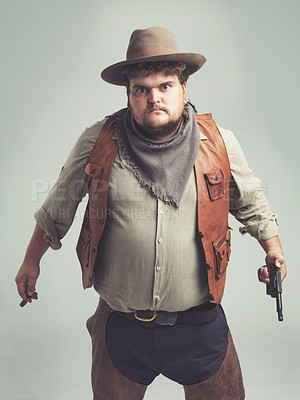 Buy stock photo An overweight cowboy looking pretty intense