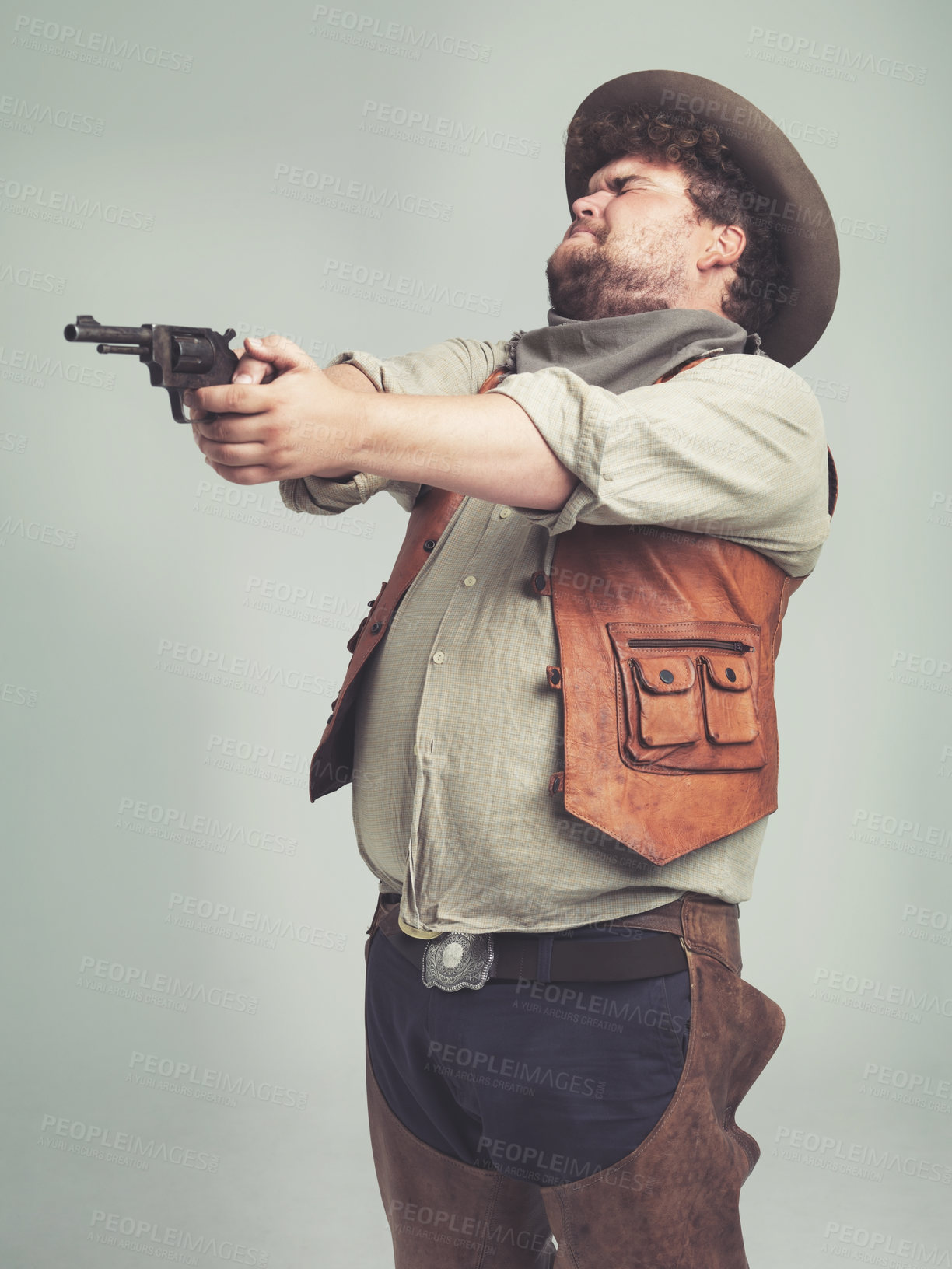 Buy stock photo Cowboy, western man and shooting gun, weapon and pistol in studio with costume isolated on a white background. Plus size, criminal and male person with revolver, aim and scared with fear in Texas
