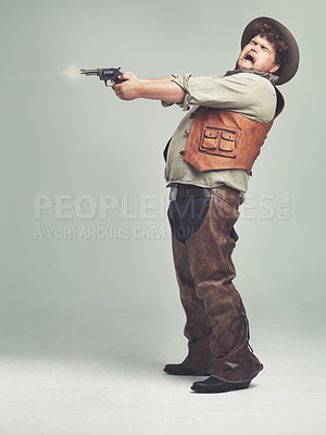 Buy stock photo Cowboy, man and shooting gun in studio, pistol or western fight isolated on a white background mockup space. Plus size, funny criminal and person with revolver, scared or screaming with fear in Texas