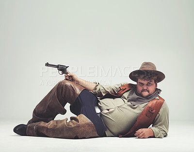 Buy stock photo An overweight cowboy giving you a 