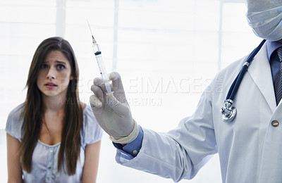 Buy stock photo Doctor, woman and needle injection or scared in hospital or anxiety for medicine treatment, disease or vaccine. Healthcare person, face mask and patient with panicked fear, nervous or trypanophobia