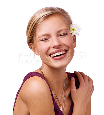Buy stock photo Flower, laugh and face of woman on a white background for skincare, wellness and spa aesthetic. Eyes closed, attractive and isolated person with floral, bloom or plant for natural cosmetics in studio