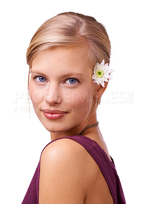Buy stock photo Studio portrait of a beautiful young woman with a flower in her hair isolated on white