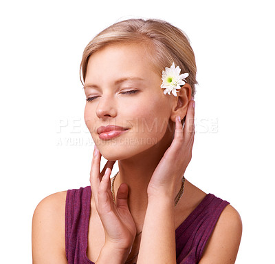 Buy stock photo Skincare, calm and woman with beauty or flower with shine, smile or skin treatment in studio. White background, face or female person isolated to relax with natural facial cosmetics, wellness or glow