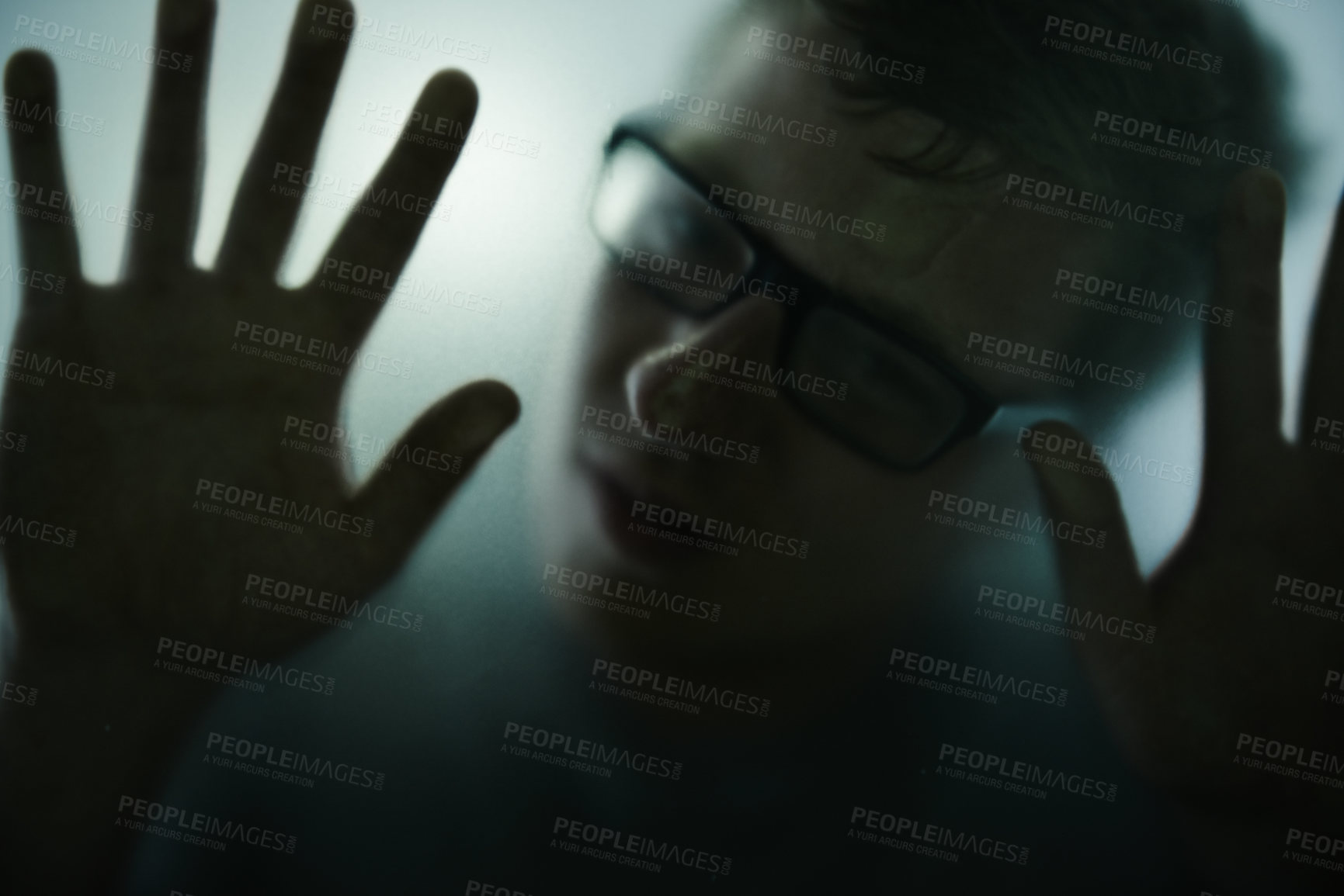 Buy stock photo Scary, mystery and man with hands on glass, window and trapped in home. Person, shadow and figure in horror, drama or creepy aesthetic with silhouette of prisoner in house with fog on screen