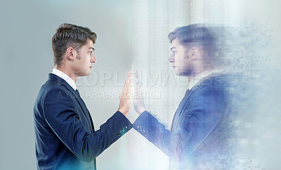 Buy stock photo Cropped conceptual shot of a handsome young man reaching out to his own reflection