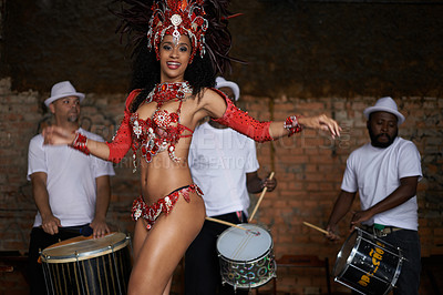 Buy stock photo Happy woman, portrait and samba dancer with band for performance at outdoor carnival in traditional costume. Female person or exotic performer dancing by musical group for party or concert in Rio