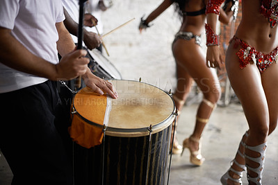 Buy stock photo Drummer, playing and music with percussion by stage, dancers and rhythm of artist with talent in band. Brazilian people, samba or performing in group as professional musician or costume for live show