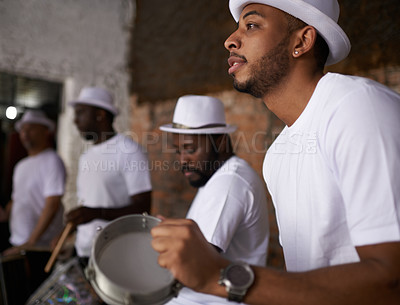 Buy stock photo Man, percussion and night with band playing music for performance, concert or musical event. Male person or group of musicians playing instruments in late evening for sound or fun local entertainment