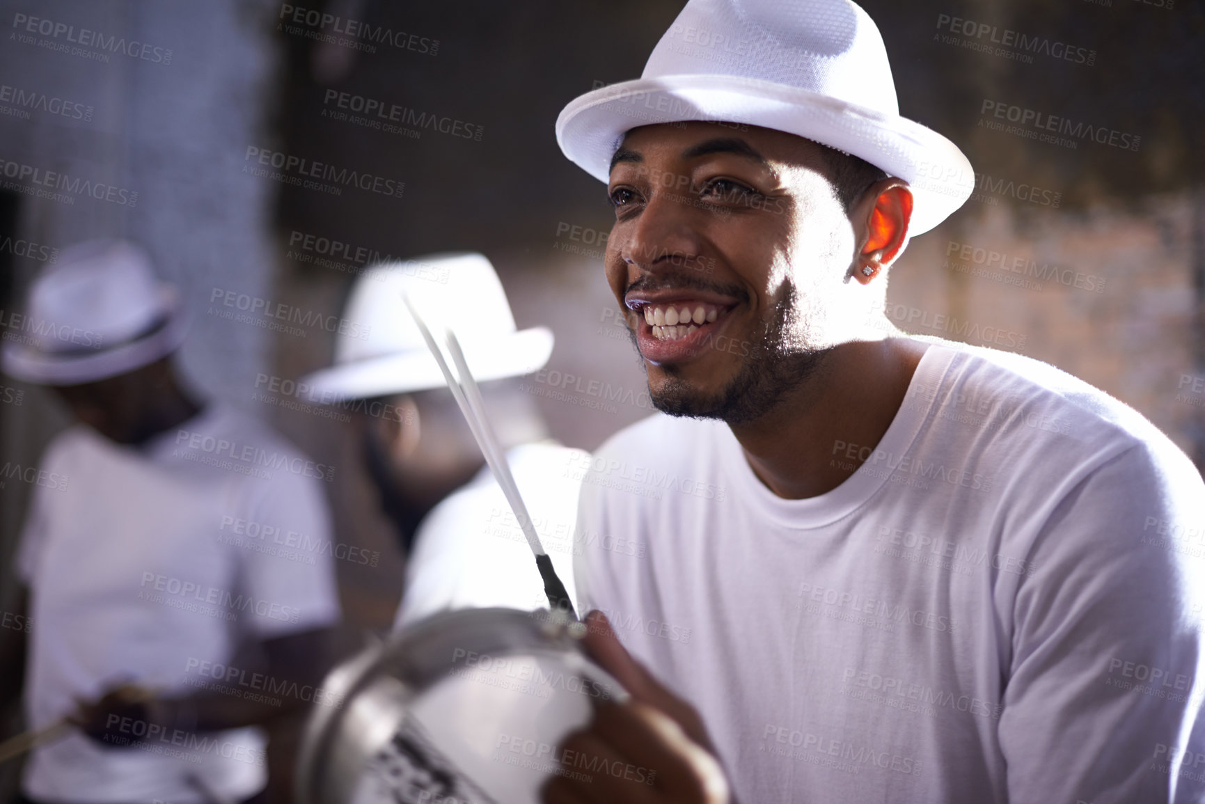 Buy stock photo Live music, smile and man with percussion instrument and band mates on stage in South Africa. Happy black person, drummer and musician for playing, singing and dancing in night club performance