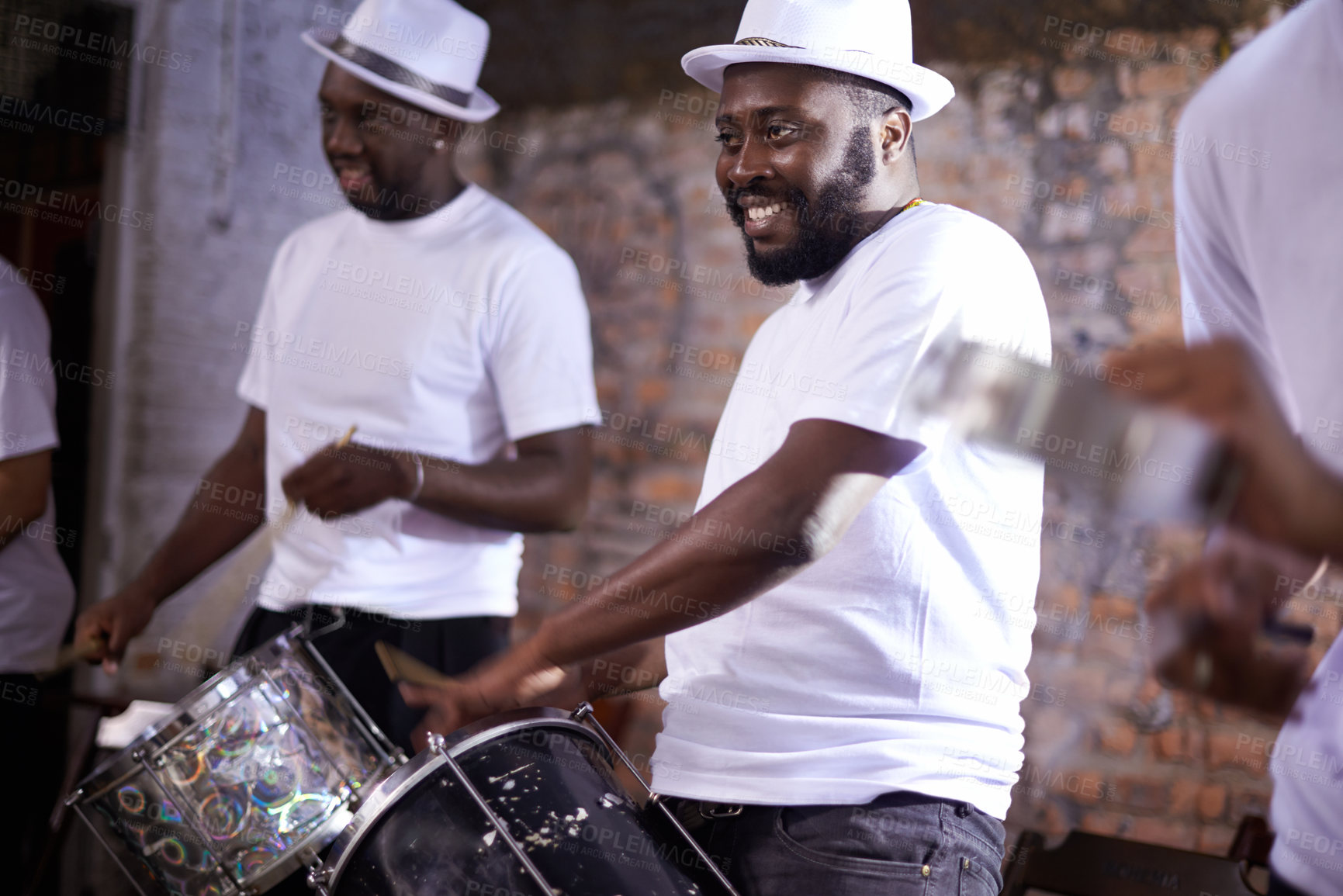 Buy stock photo Carnival, drummer and music with band in Brazil for entertainment, festival or performance event. Smile, concert and black man playing drums in Rio de Janeiro for culture, heritage or tradition