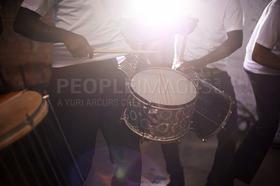 Buy stock photo Cropped shot of a band playing their percussion instruments in a Brazilian setting