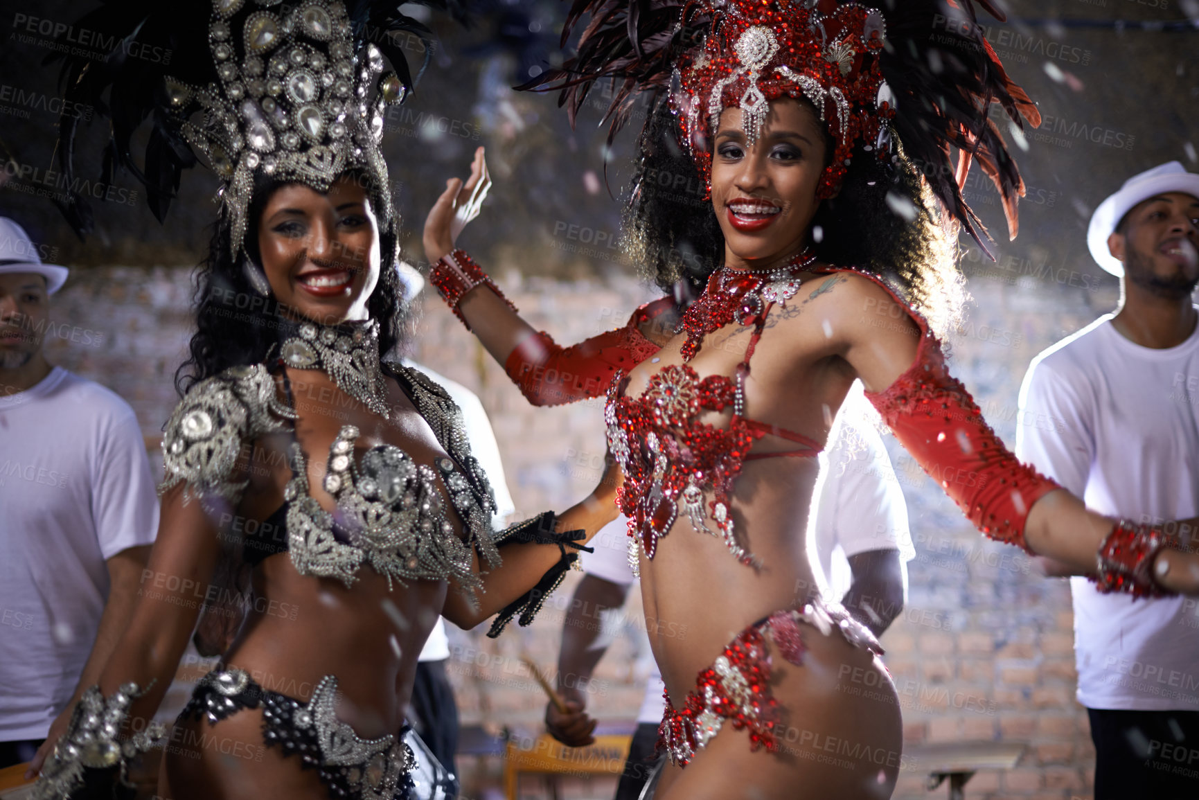 Buy stock photo Samba, portrait and performance of women in Rio de Janeiro, smile and dancing for crowd with energy. Female people, artistic and clothes from feather for fashion with culture, music and celebration