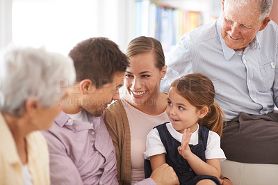 Buy stock photo Parents, grandparents and child with smile on sofa for healthy development, security or comfort in apartment. Family, men and woman with girl kid, happiness or bonding for parenting and love in house