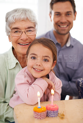 Buy stock photo Cupcakes, candles and girl with birthday, family and grandmother with happiness, candy and home. Childhood, celebration and dad with dessert or joy with party or smile with wow, sweet or surprise