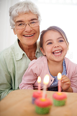 Buy stock photo Cupcakes, child and granny with birthday, girl and laugh with happiness, candy and cheerful kid. Grandmother, celebration or excited with dessert or portrait with party or box with wow, sweet or home