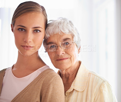 Buy stock photo Portrait of a young woman and her senior mother bonding