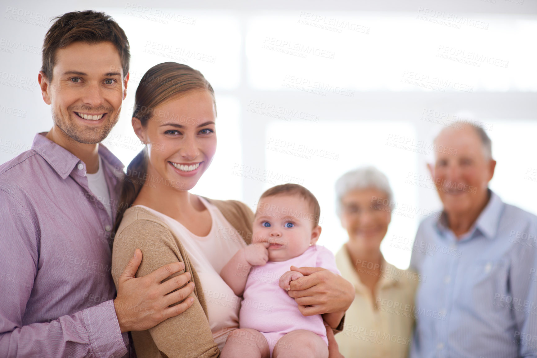 Buy stock photo Portrait, happy family and baby in home with parents for bonding together, love and care of infant. Face, grandparents and child with mother, father and kid in living room with a smile for connection