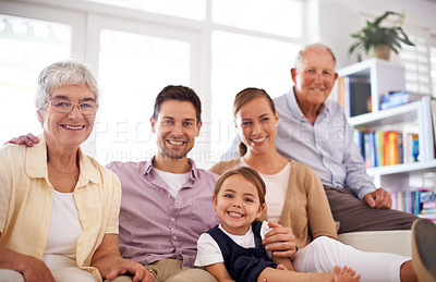 Buy stock photo Portrait, big family and happy child on sofa in home for bonding, love or kid relax together with parents. Face, grandparents and girl with mother and father in living room with smile for connection