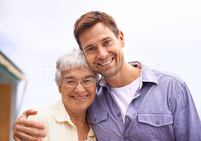 Buy stock photo A mother and son looking at the camera