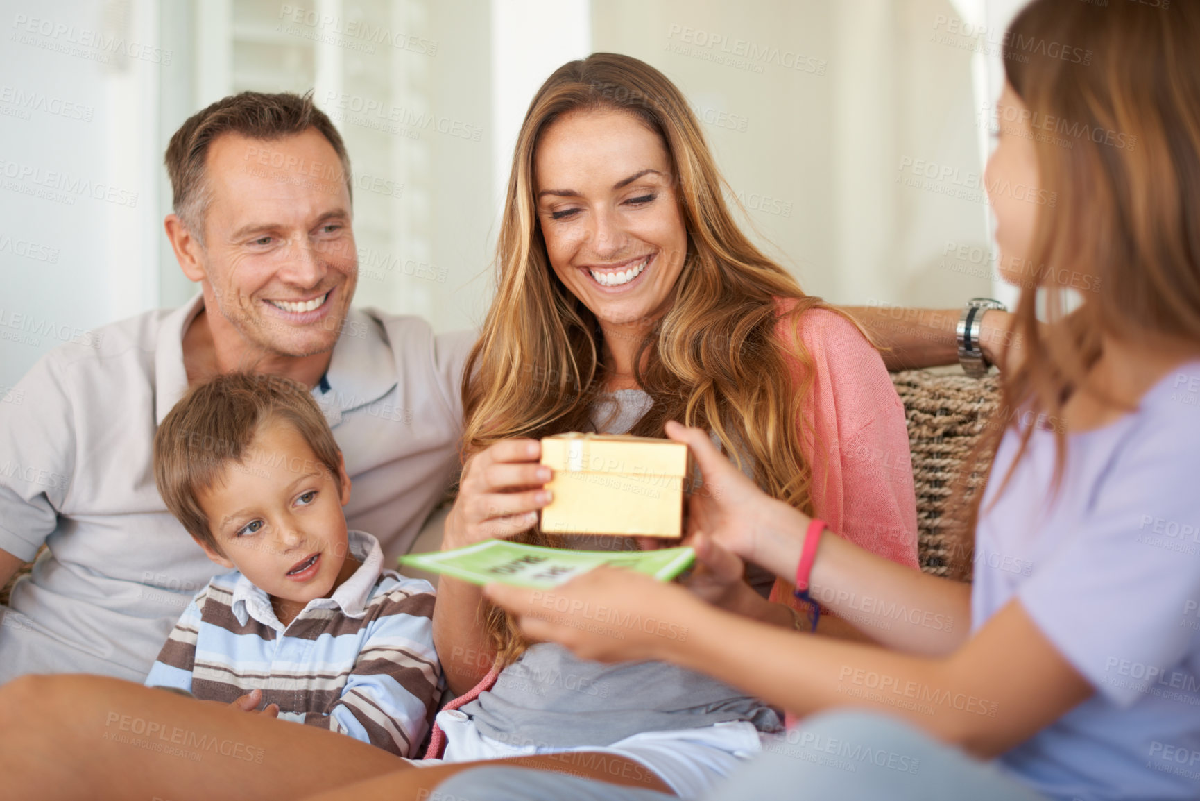 Buy stock photo Cropped shot of a happy young family on Mother's day