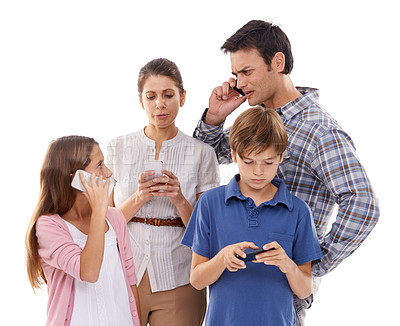 Buy stock photo Family, phone and technology in studio for communication with text message, conversation and video streaming. Father, mother and children with smartphone, internet and mobile chat on white background