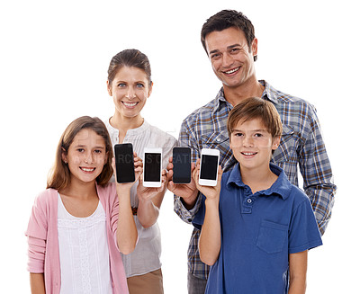 Buy stock photo Studio shot of a family holding up their smartphones isolated on white
