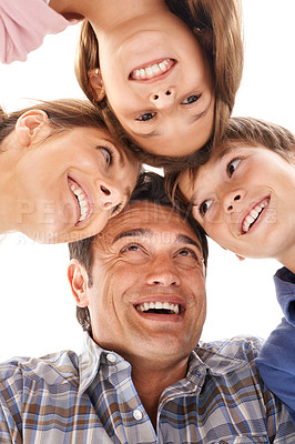Buy stock photo Face of mother, father and children on a white background for bonding, relationship and love. Family, happy and low angle of isolated mom, dad and kids for support, care and together in studio
