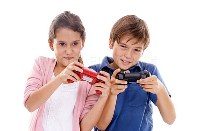 Buy stock photo Kids, video game and controller for siblings in studio, portrait and competition by white background. Girl, boy or family children with gaming, press and contest with strategy, cheating or playing