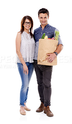 Buy stock photo Happy couple, portrait and grocery bag with vegetables for food, natural sustainability or nutrition on a white studio background. Young man and woman with smile for healthy ingredients or shopping