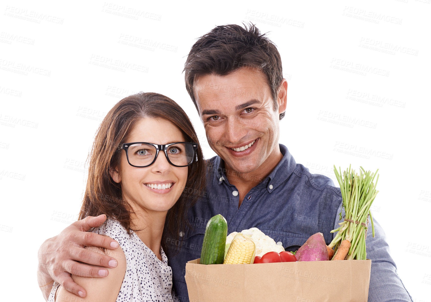 Buy stock photo Happy couple, portrait and shopping bag with vegetables for food, natural sustainability or nutrition on a white studio background. Young man and woman with smile for healthy ingredients or groceries