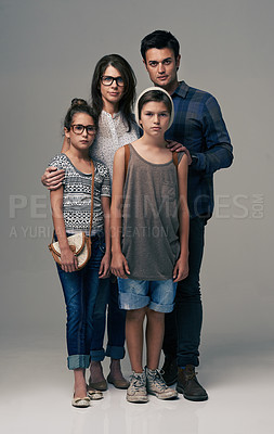 Buy stock photo Parents, kids and together in studio portrait with pride, care and support with love by background. Mother, father and children in group for family, kindness and clothes with trendy fashion for style