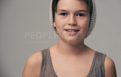 Buy stock photo Boy, child and beanie in studio for portrait with smile, teenager or edgy for fashion by background. Kid, model and hat for trendy style, happy and pride for clothes with confidence in hipster outfit