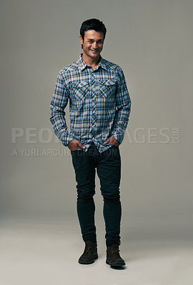 Buy stock photo Happy man, portrait and fashion with style or trendy clothes on a gray studio background. Handsome male person or young model with casual clothing or stylish outfit in confidence on mockup space