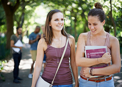 Buy stock photo Happy, student and walking on campus with education, learning and books for knowledge in university. Young women or friends talking outdoor, park or college for scholarship, study and collaboration