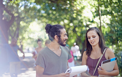 Buy stock photo Cropped shot of a male and female student on campus