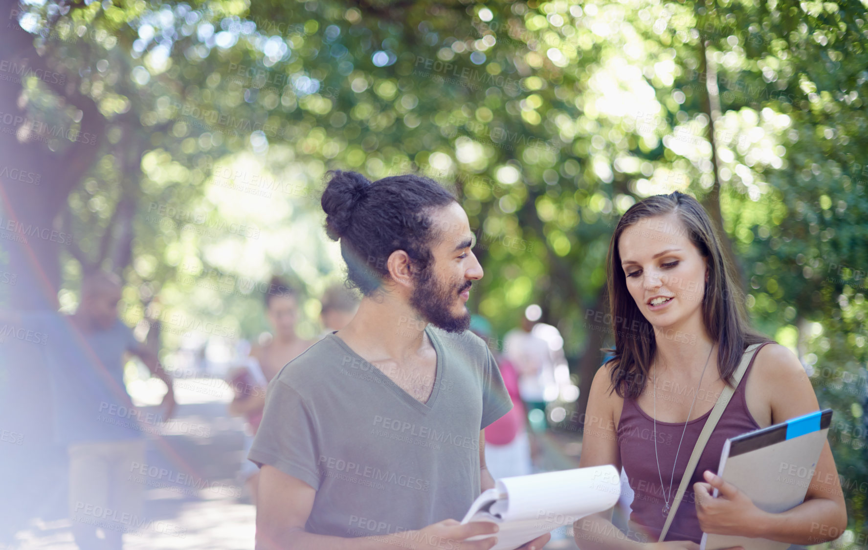 Buy stock photo Cropped shot of a male and female student on campus