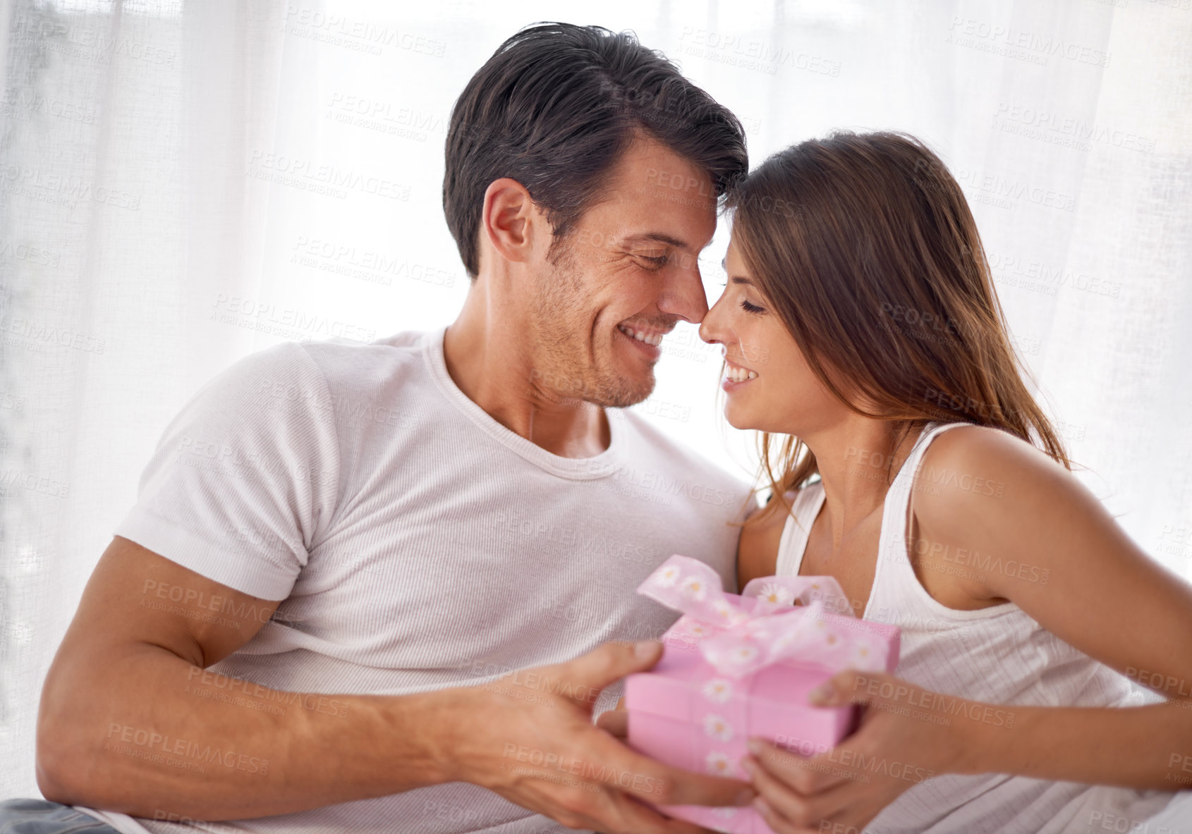 Buy stock photo Man giving woman gift box, love and happiness with partnership, relationship and celebration on Valentines day date. Couple smile with present, luxury and commitment, gratitude and celebrate holiday