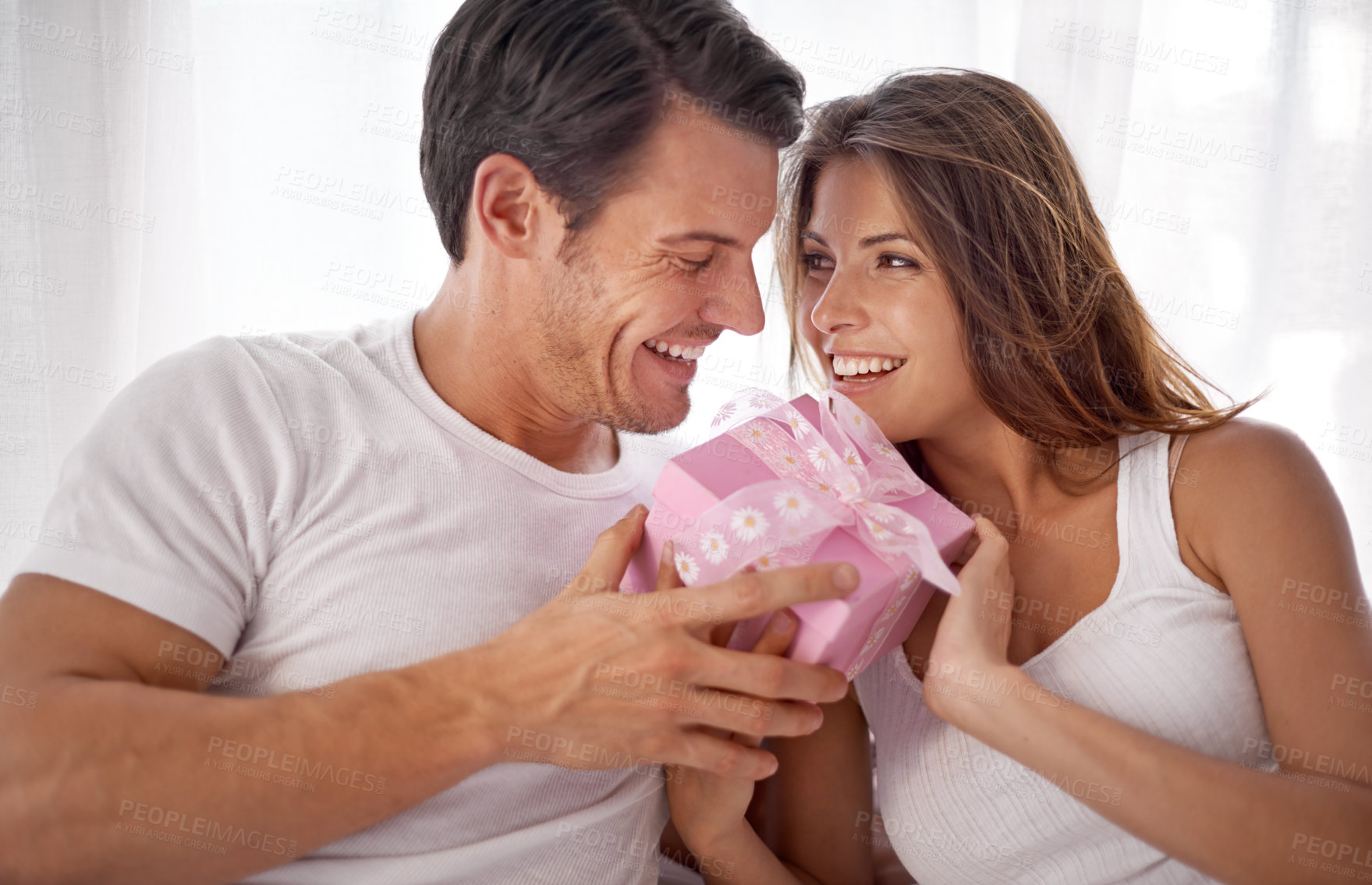 Buy stock photo Man, woman with gift box and smile, love and happiness with partnership, relationship and celebration on Valentines day. Couple with present, luxury and commitment, gratitude and celebrate holiday