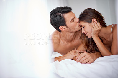 Buy stock photo Care, love and man kissing his wife in the morning after an anniversary, date or intimate time in bed. Gratitude, relax and young couple in the bedroom on a honeymoon for valentines day together