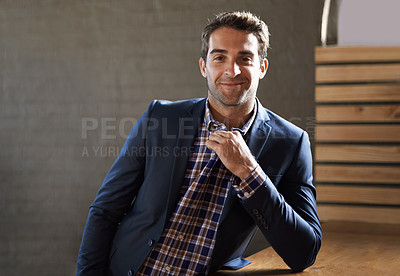 Buy stock photo Portrait of a handsome young man standing happily next to a bar counter