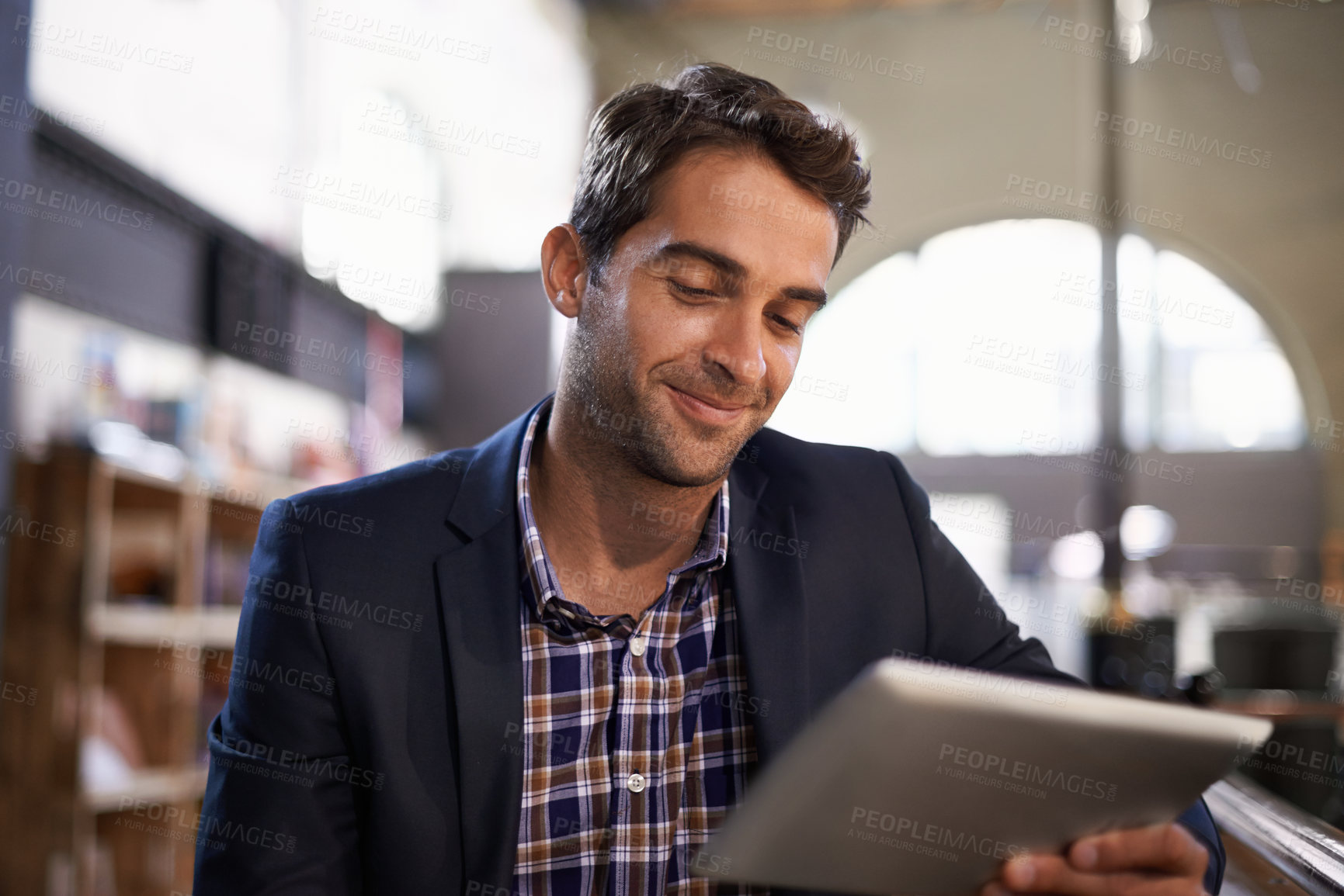 Buy stock photo Digital, happy man with tablet and in coffee shop or restaurant. Social media or communication, technology or networking for remote work and male person in cafe store or local pub on mobile device