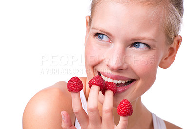 Buy stock photo Happy, playful and woman eating raspberries, fingers and wellness isolated on white studio background. Person, mockup space or model with fruit and funny with nutrition, fresh or cheerful with health