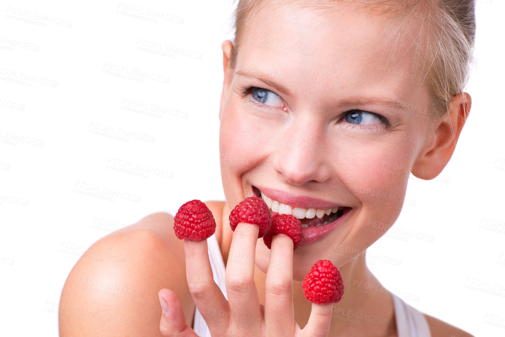 Buy stock photo Happy, playful and woman eating raspberries, fingers and wellness isolated on white studio background. Person, mockup space or model with fruit and funny with nutrition, fresh or cheerful with health