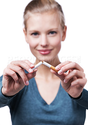 Buy stock photo Studio, portrait and happy woman with broken cigarette to quit tobacco for health, wellness and results. White background, girl and stop smoking for healthcare benefits, commitment and support.